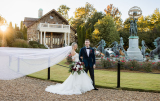 Bride and groom standing in front of the venue,2400 On The River