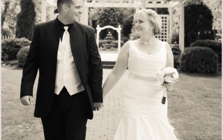 bride and groom holding hands