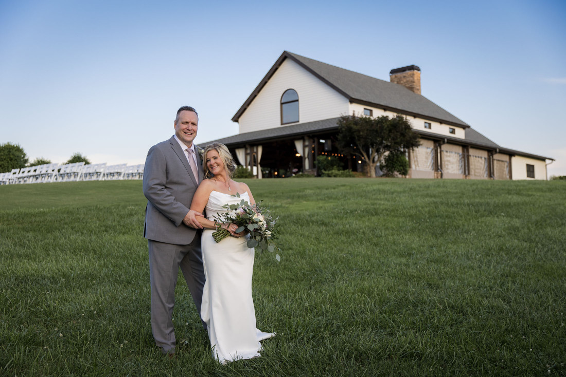 cenita-venue Portrait of a bride and groom in front of CeNita Vineyards