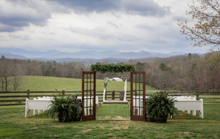 Photo of a Summit Farm wedding ceremony with a mountain backdrop
