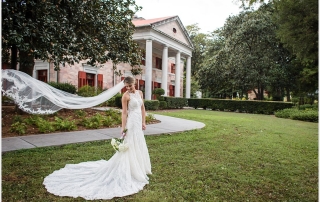 A bride's portrait in front of the Tate House