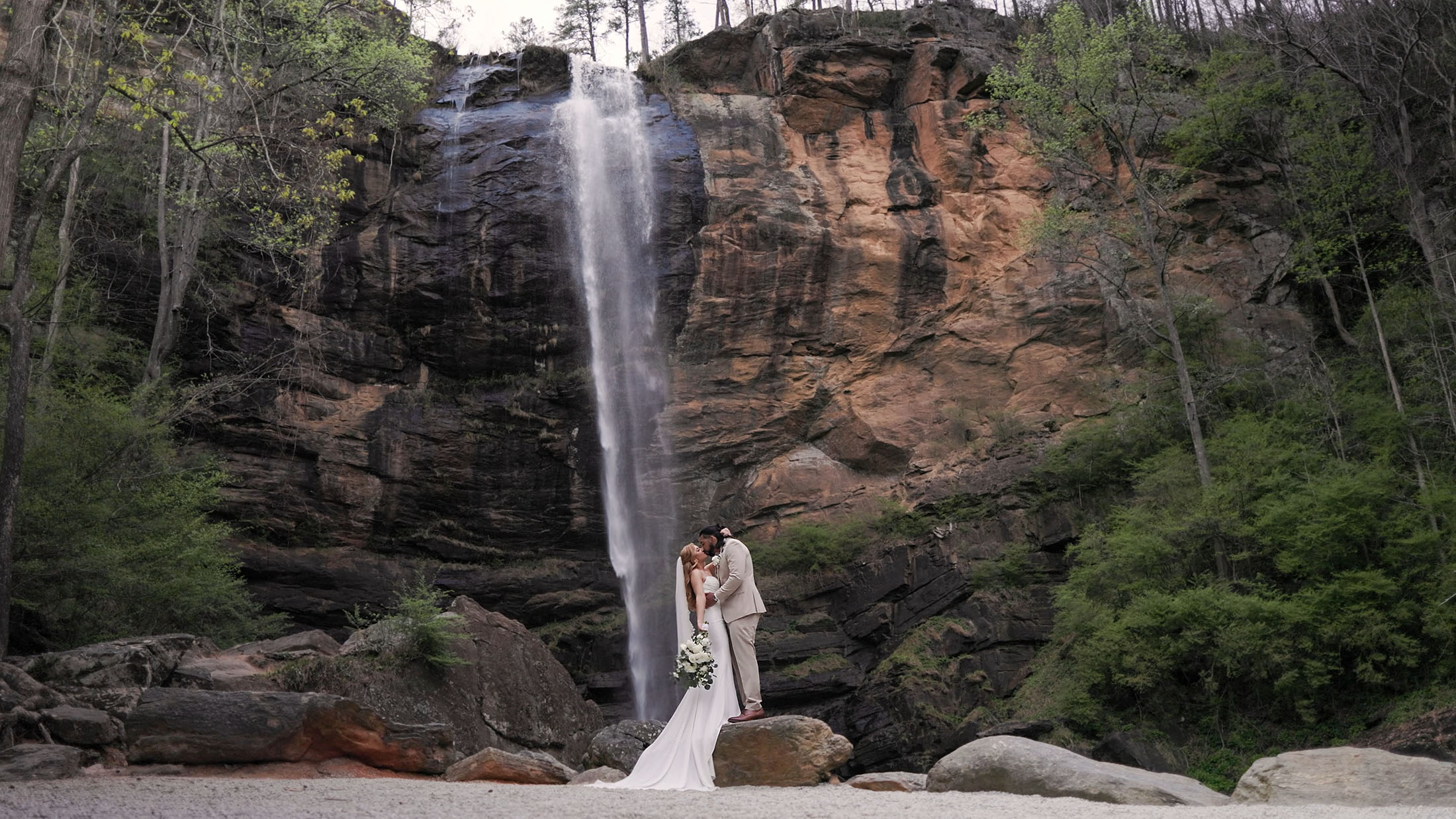 toccoa-falls-wedding-06a Wide angel shot of a bride and groom in front of Toccoa Falls