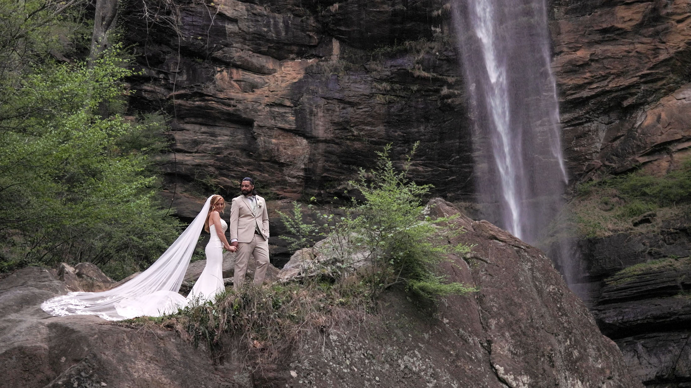 toccoa-falls-wedding-08b Wide angel shot of a bride and groom with mostly rocks in the background