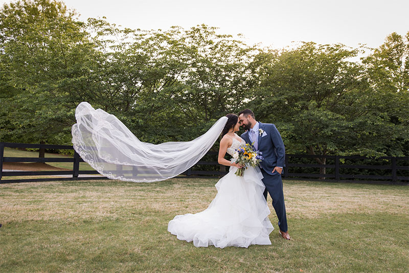 Bride and Groom with a flowing veil