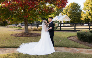 Bride and groom portrait in front of White Laurel Estate gazebo